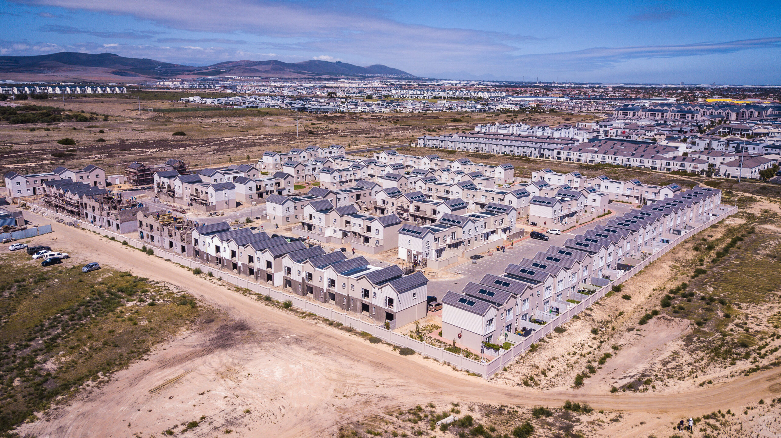 Aerial view of large-scale residential development at dusk
